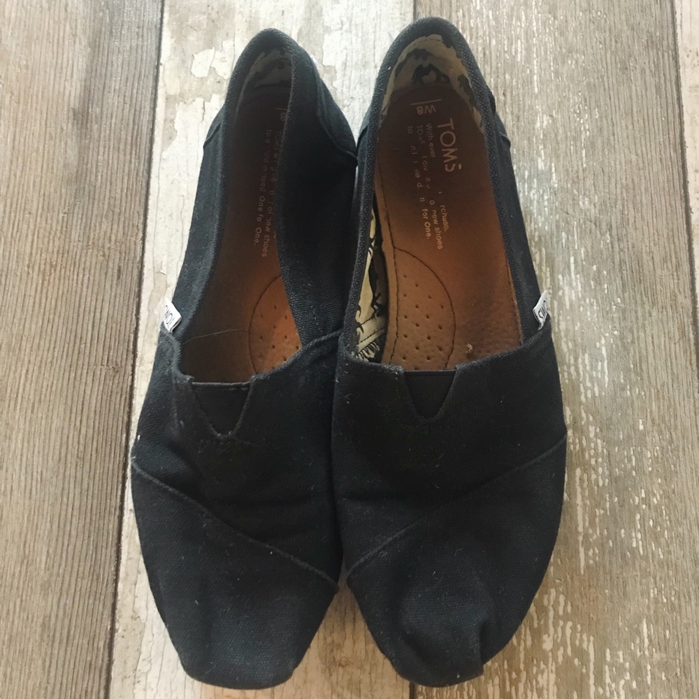Women’s black slip on toms